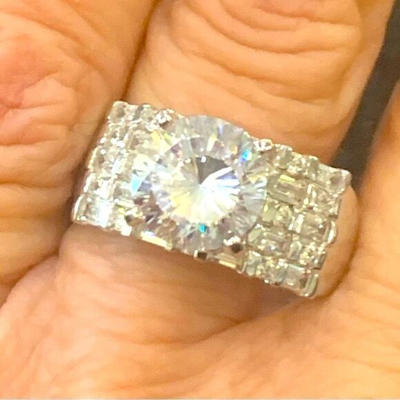 5.5 DEW  center stone with 3 rows of rounds . Rhodium plated . Size 10 - Picture 1 of 5